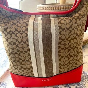 Coach signature shoulder bag - coral leather with signature brown/cream pattern.